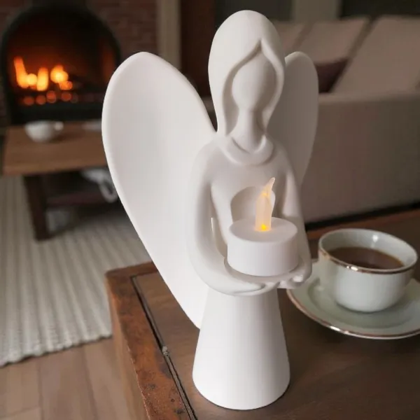 Angel holding a tealight